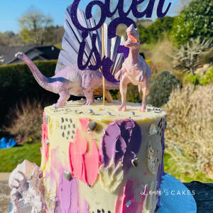 Celebration cake: A dinosaur and a cake topper