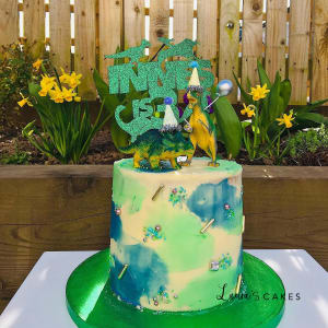 Celebration cake: A green and yellow design on it