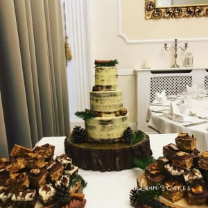 Wedding cake: A table with three cakes on it