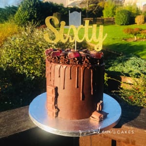 Celebration cake: A chocolate cake with a sign that says you