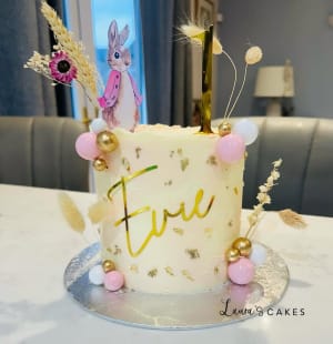 Celebration cake: A bunny on top and a pink bunny on the side