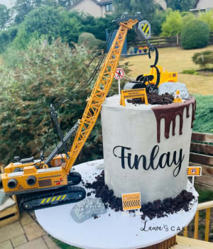 Celebration cake: A construction cake with a crane and a digger truck