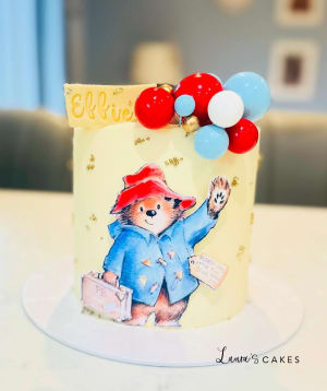 Celebration cake: A picture of a mouse on it