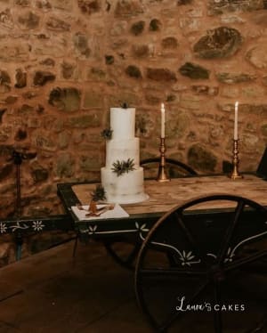 Wedding cake: A table with candles and a candle holder