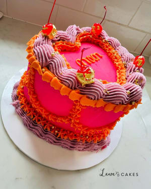 Celebration cake: A pink frosting and orange icing