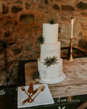 Wedding cake: A white wedding cake with greene on top