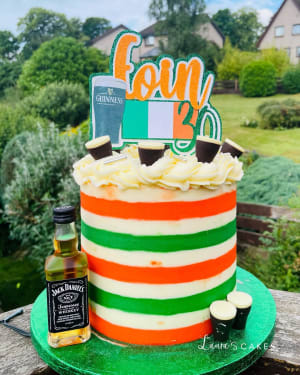 Celebration cake: A flag and a bottle of whiskey
