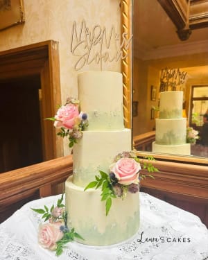Wedding cake: Pink roses and greene on top