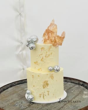Wedding cake: A white cake with gold and silver decorations
