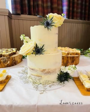 Wedding cake: A white cake with yellow flowers on top