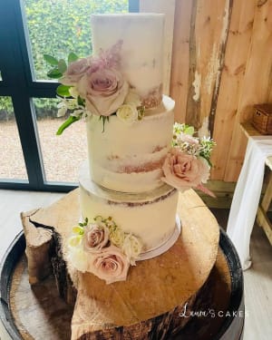 Wedding cake: A white cake with pink flowers on top