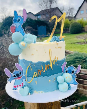 Celebration cake: A blue and yellow fonding and a littlestufn cake topper