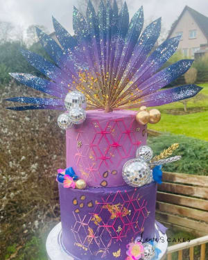 Celebration cake: A purple cake with a purple and gold design
