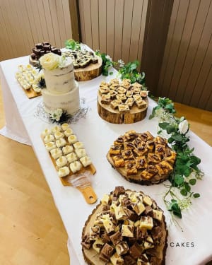 Wedding cake: A table topped with desserts and a cake