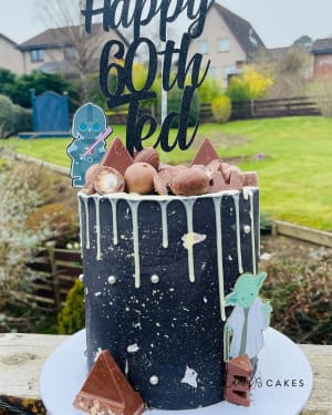 Celebration cake: A black and white cake with a drip drip drip drip drip drip drip drip drip drip drip drip drip drip