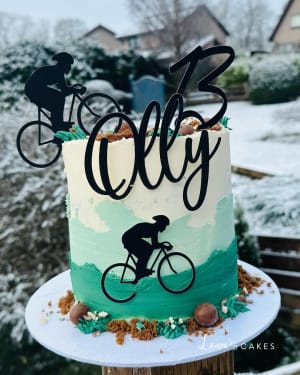 Celebration cake: A bike and a bicycle on top