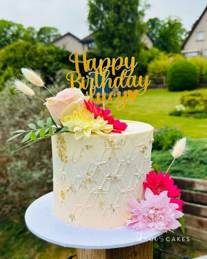 Celebration cake: A happy birthday sign on top