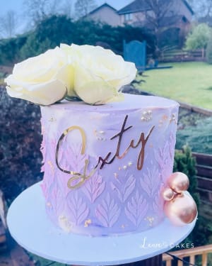 Celebration cake: A pink and gold design on top