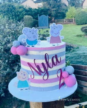 Celebration cake: A couple on top and a couple on the bottom