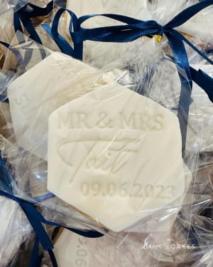 Wedding cake: A white soap bar with blue ribbon and a blue ribbon
