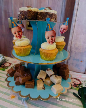 Celebration cake: A cupcake with a cake on top