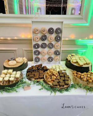 Wedding cake: A table with desserts and pastries on it