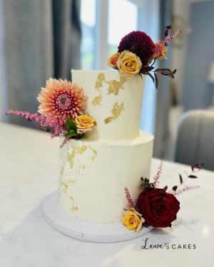 Wedding cake: A white cake with flowers on top