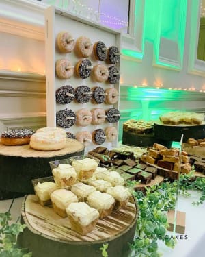 Wedding cake: A table with various types of doughs and pastries