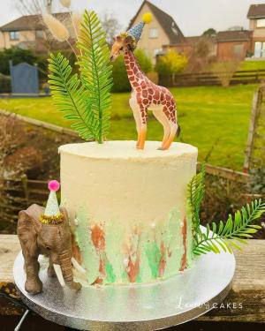 Celebration cake: A gi and an elephant on top