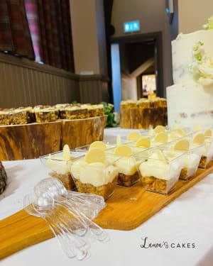 Wedding cake: A table with a cake and desserts on it