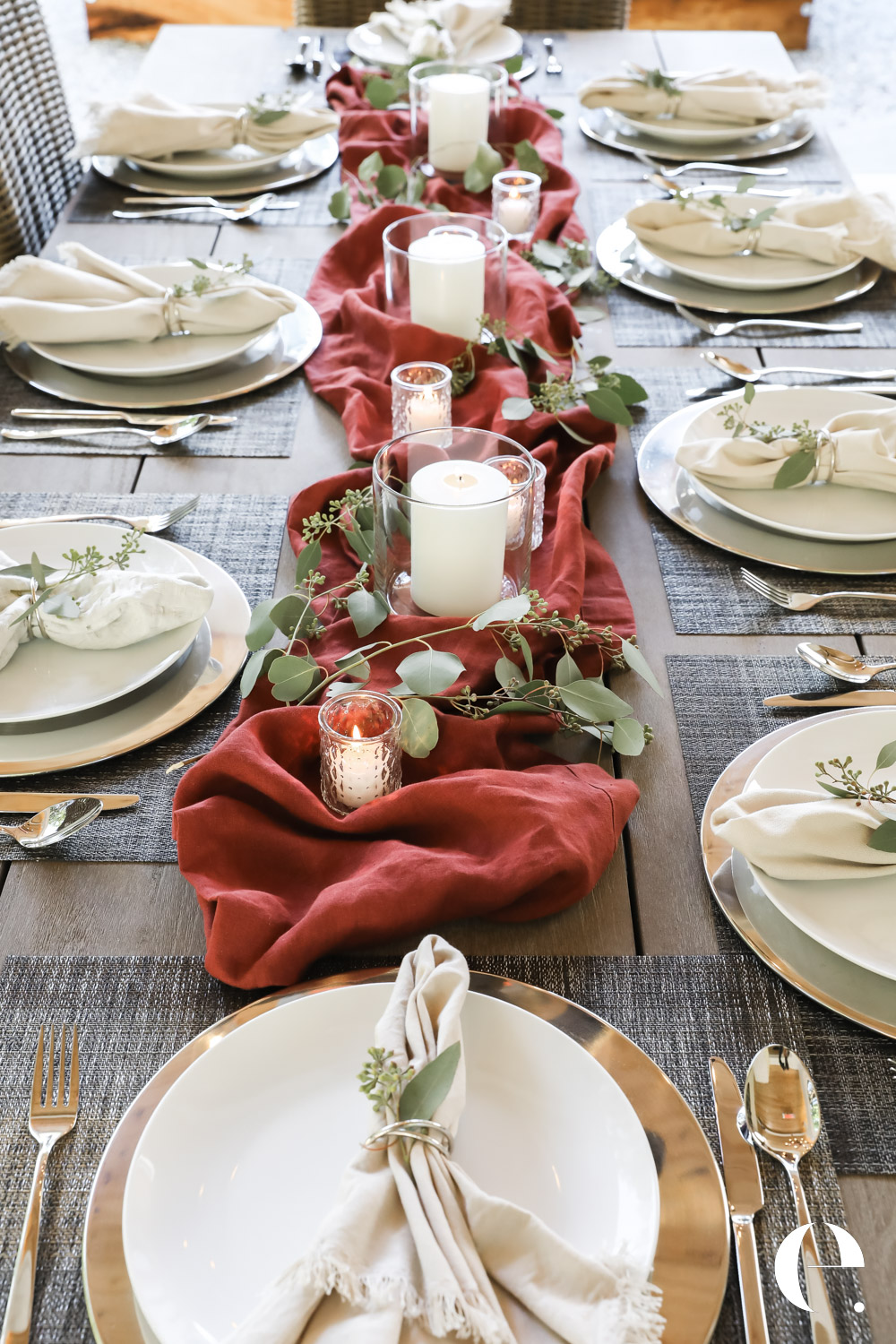 A welcoming dining area prepared for guests with warm lighting and fresh flowers