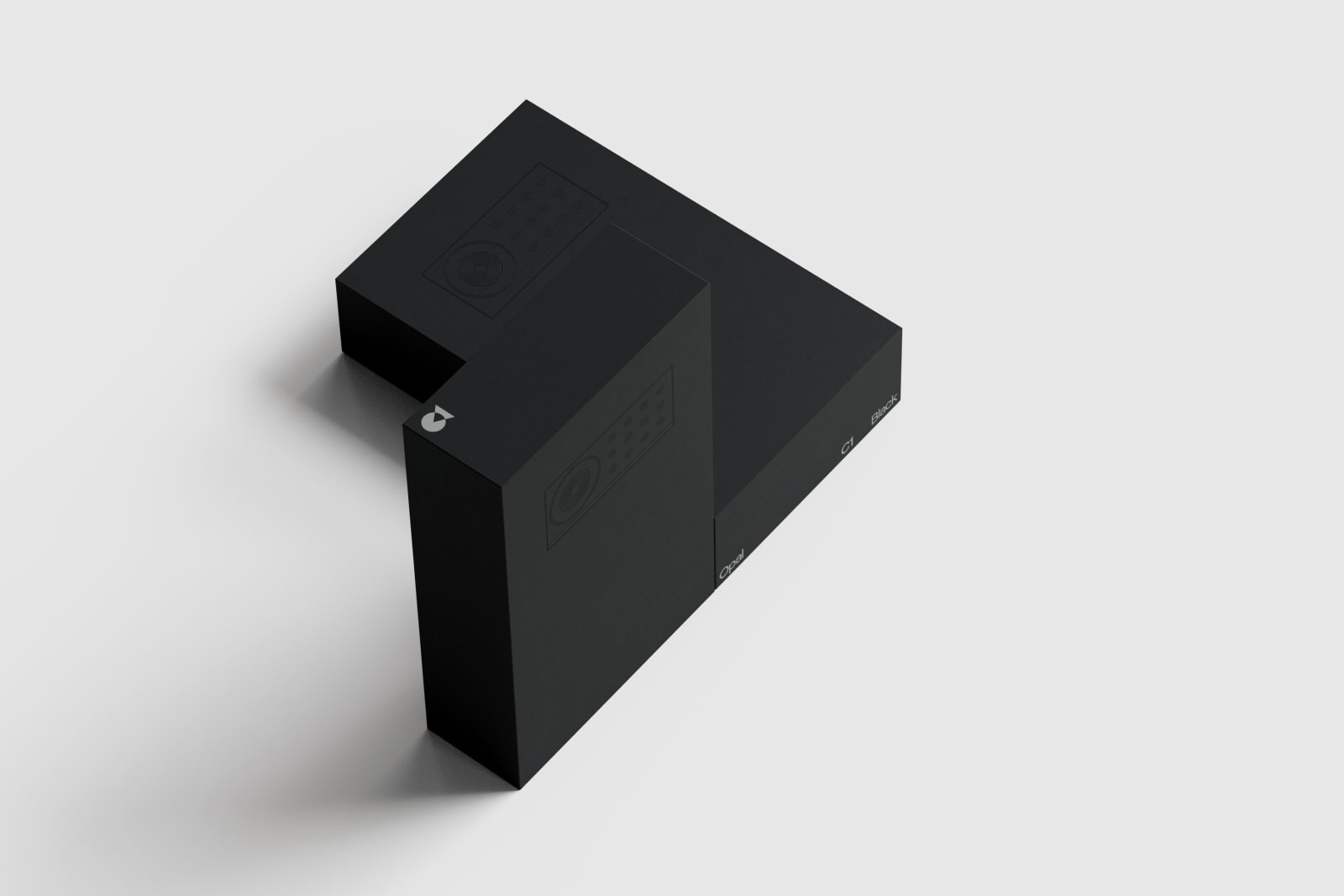 Matte black two-piece packaging box for Opal C1 webcam, photographed in L-formation on white background