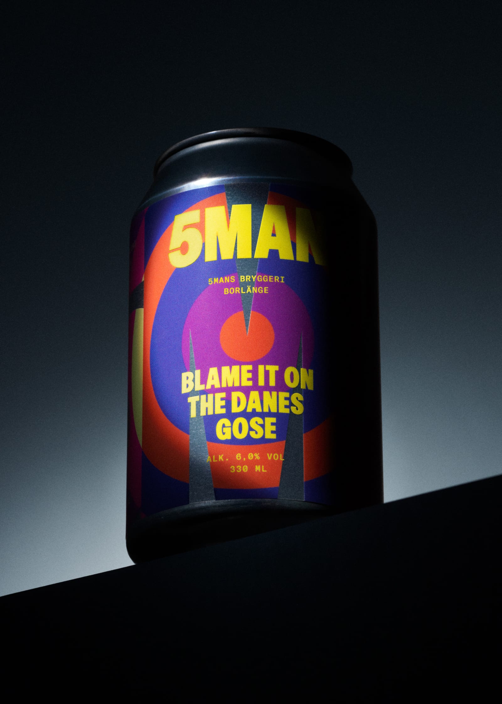 5MAN Blame It on the Danes Gose 330ml can with deep purple label, orange concentric circles, and bold yellow 5MAN wordmark, shot dramatically against dark background