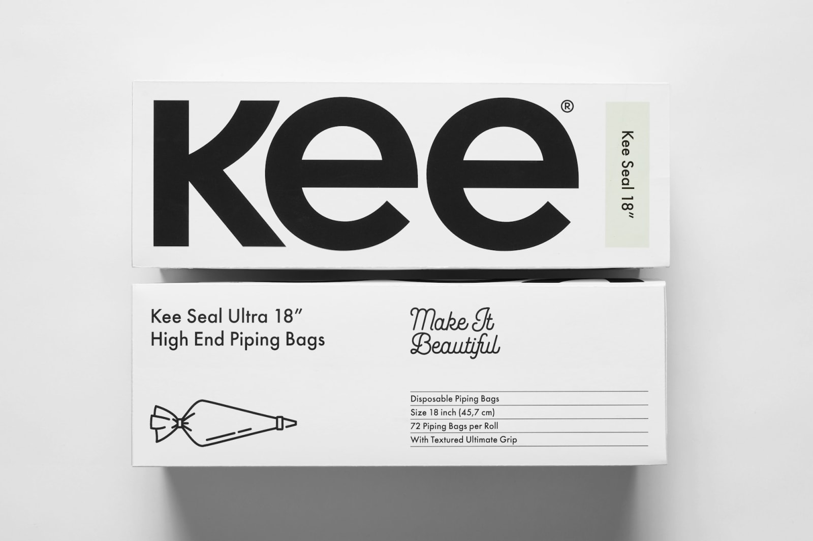 Two white Kee boxes overhead — top shows bold kee wordmark with cream tab, bottom shows back face with Make It Beautiful script, specs table, and piping bag line illustration