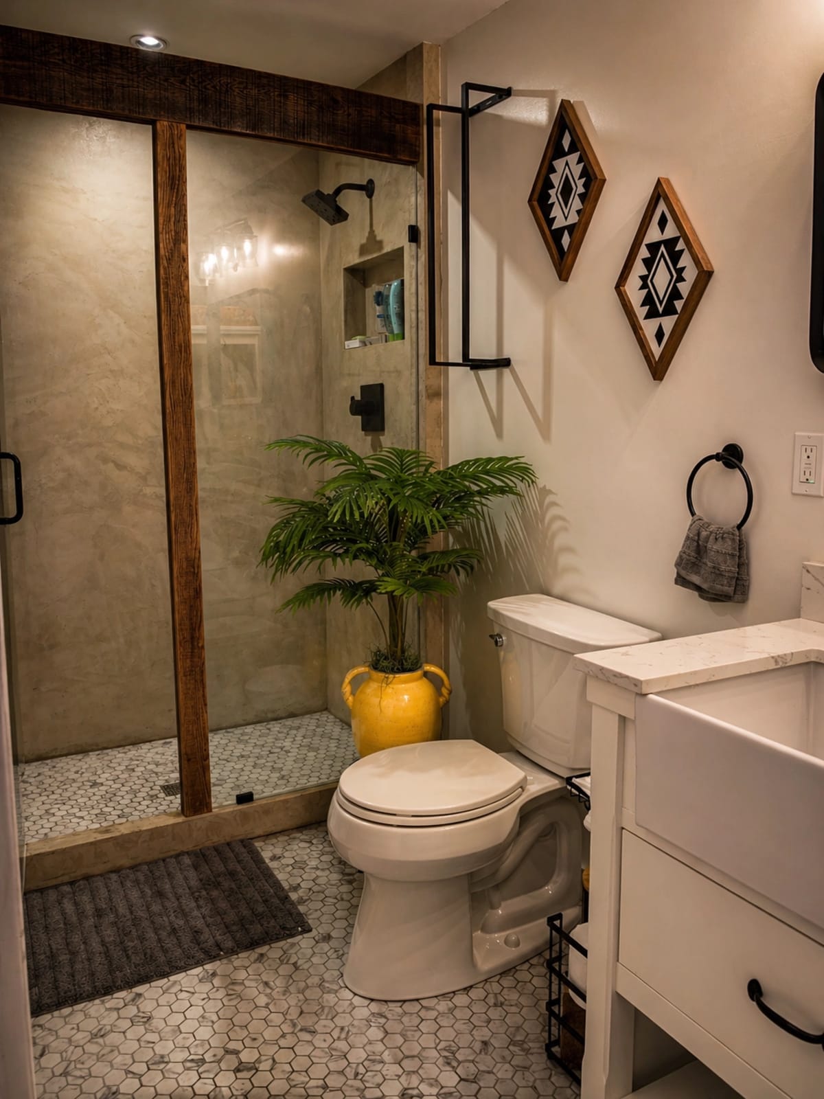 Bathroom with venetian plaster shower, wood shower trim, black fixtures, and marble hex tile floor