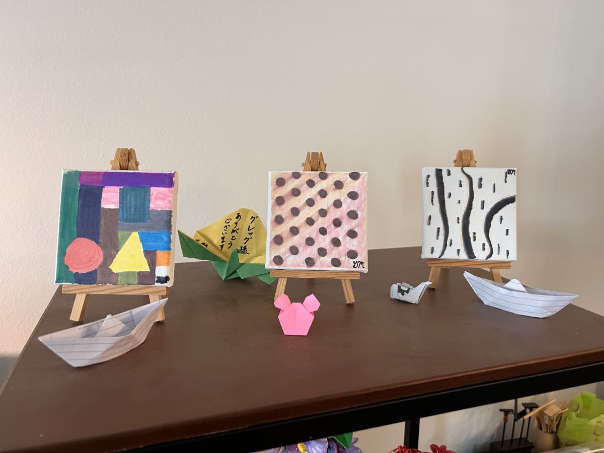 Art shelf with this months paintings and newly added origami Art shelf with this months paintings and newly added origami