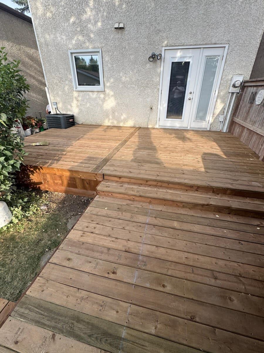 Two-level wood deck at the patio doors