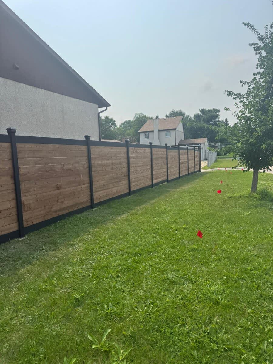 Horizontal wood privacy fence with black posts