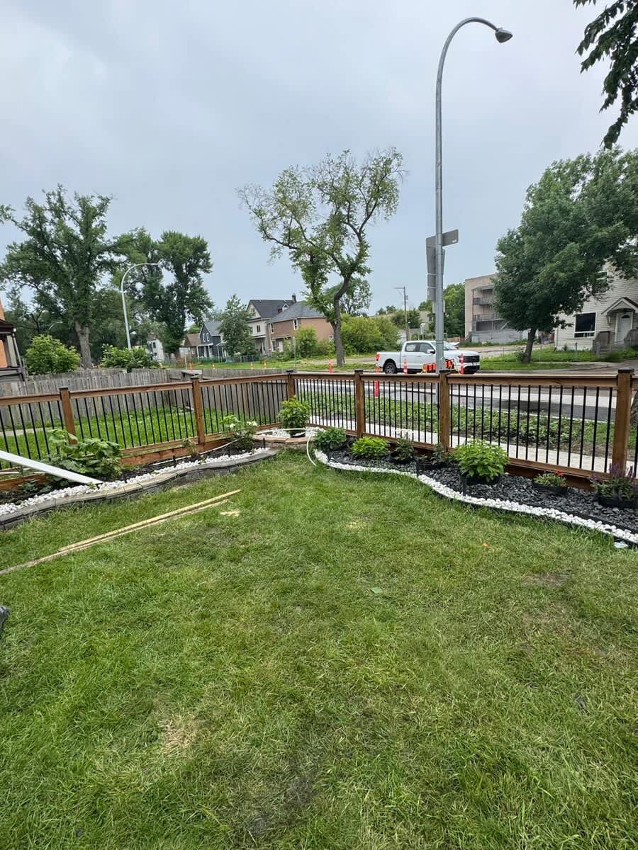 Front-yard wood fence with black metal balusters
