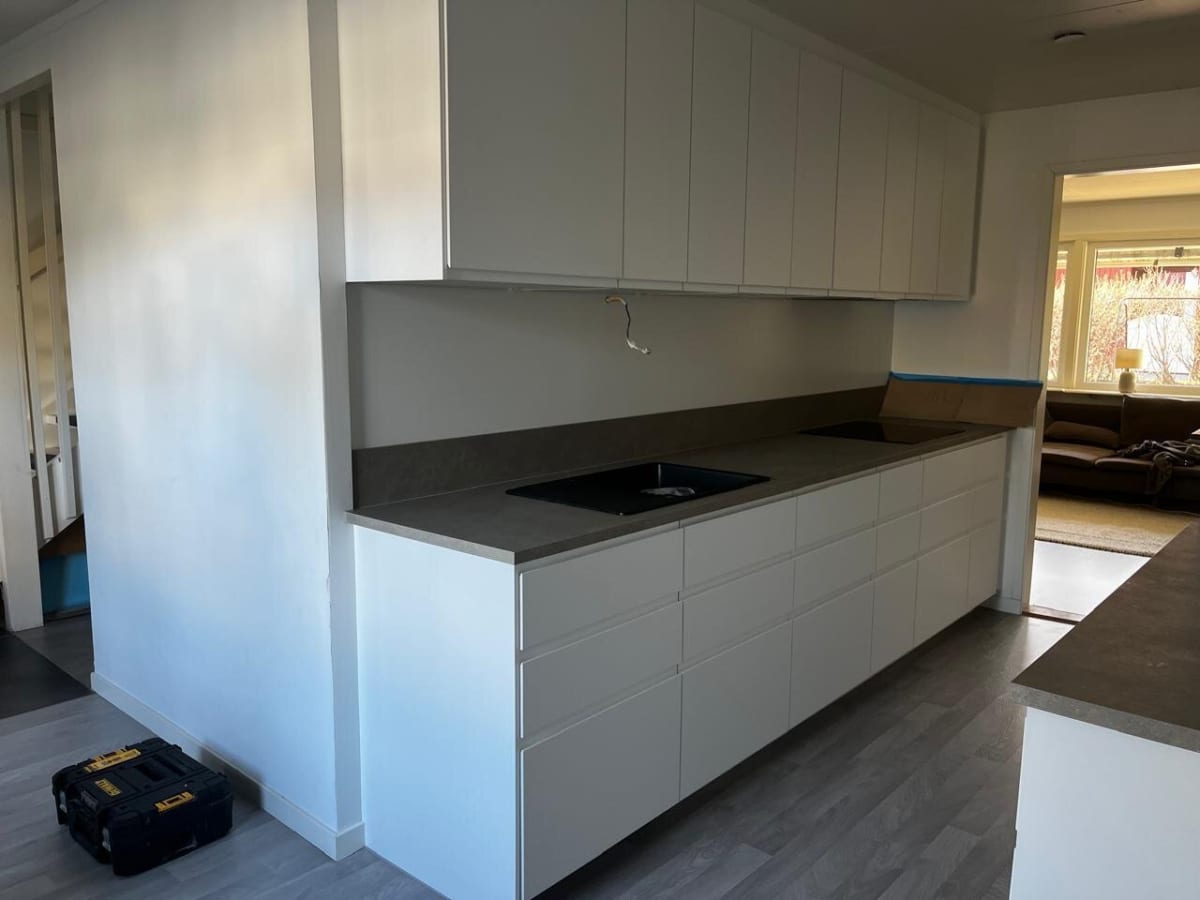 Modern white kitchen with grey countertops
