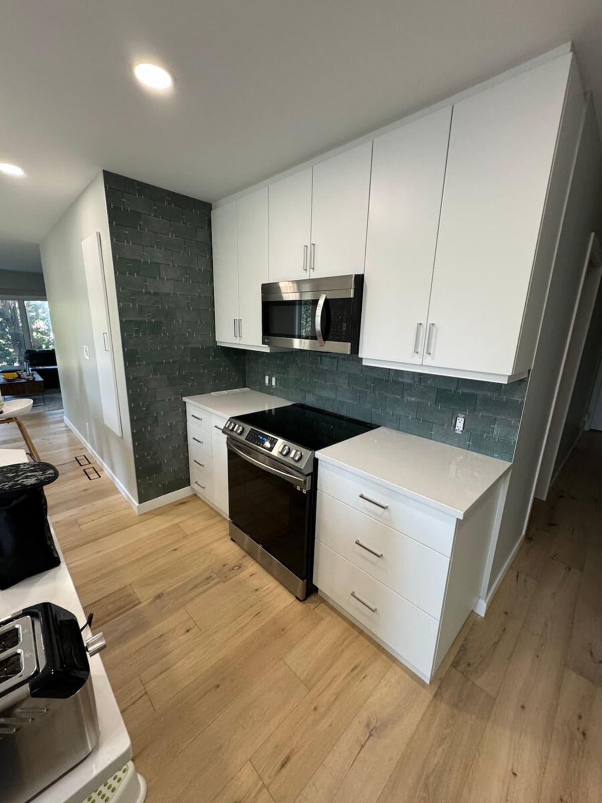 White kitchen with dark backsplash