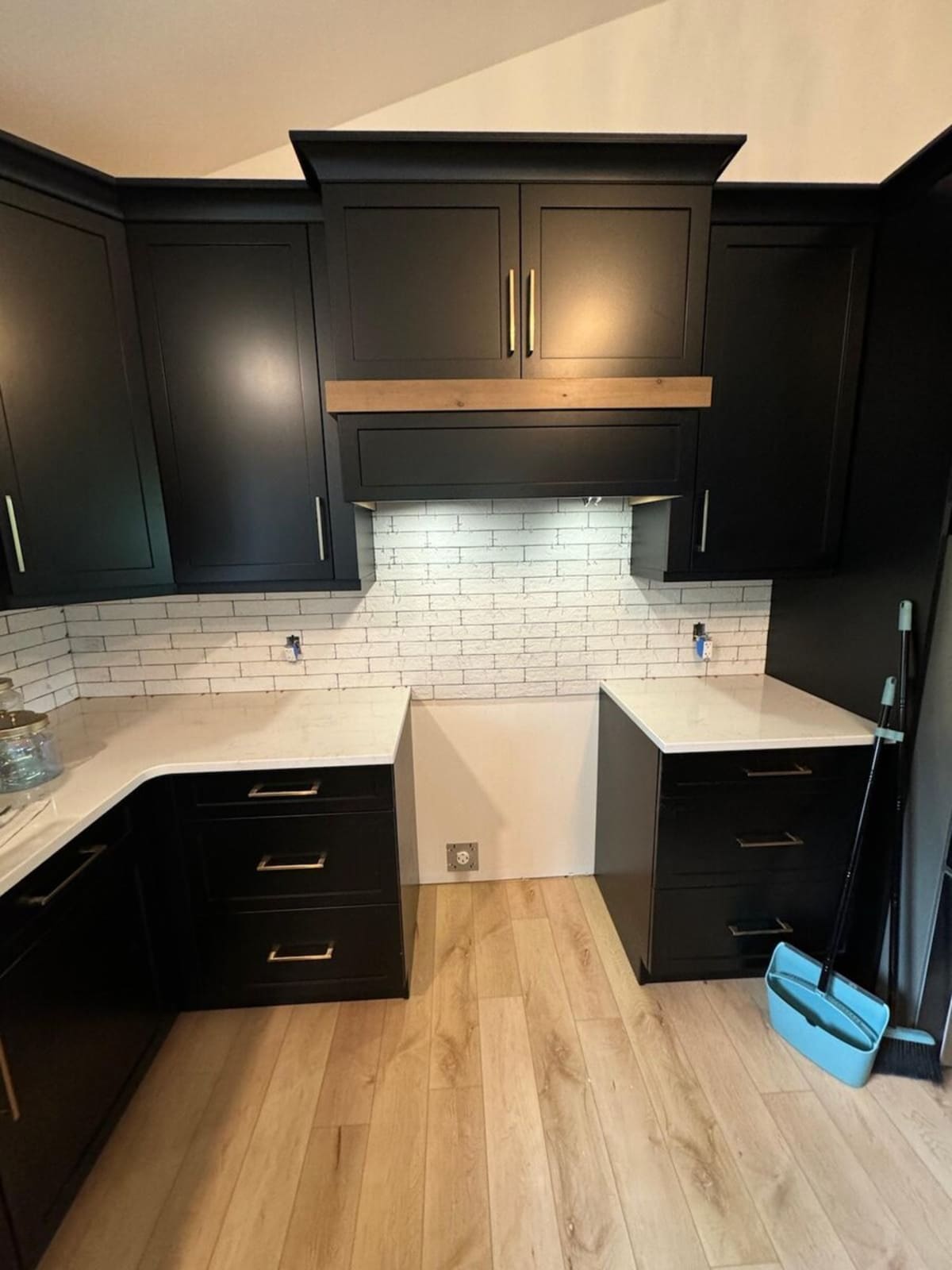 Dark kitchen with subway tile backsplash