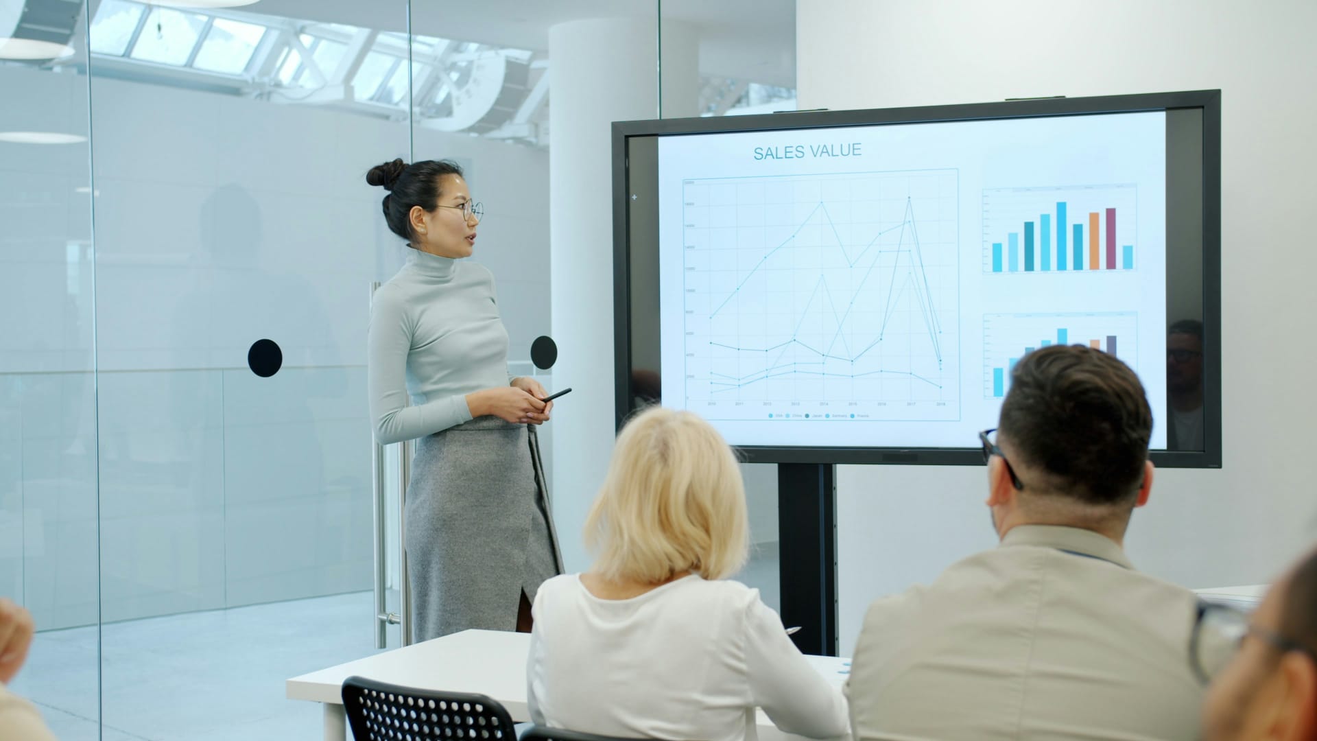 Business professional presenting in boardroom