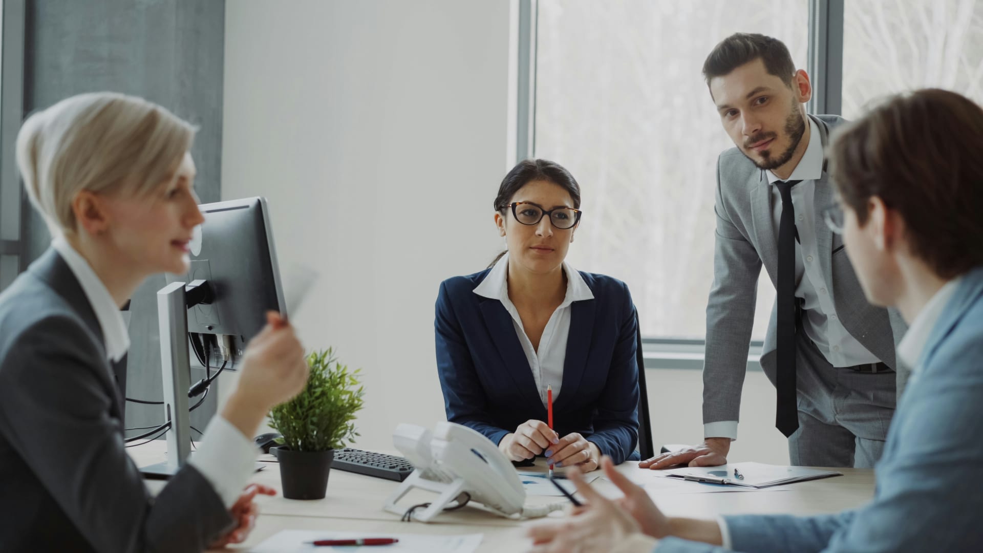 Business professionals in meeting discussing strategy
