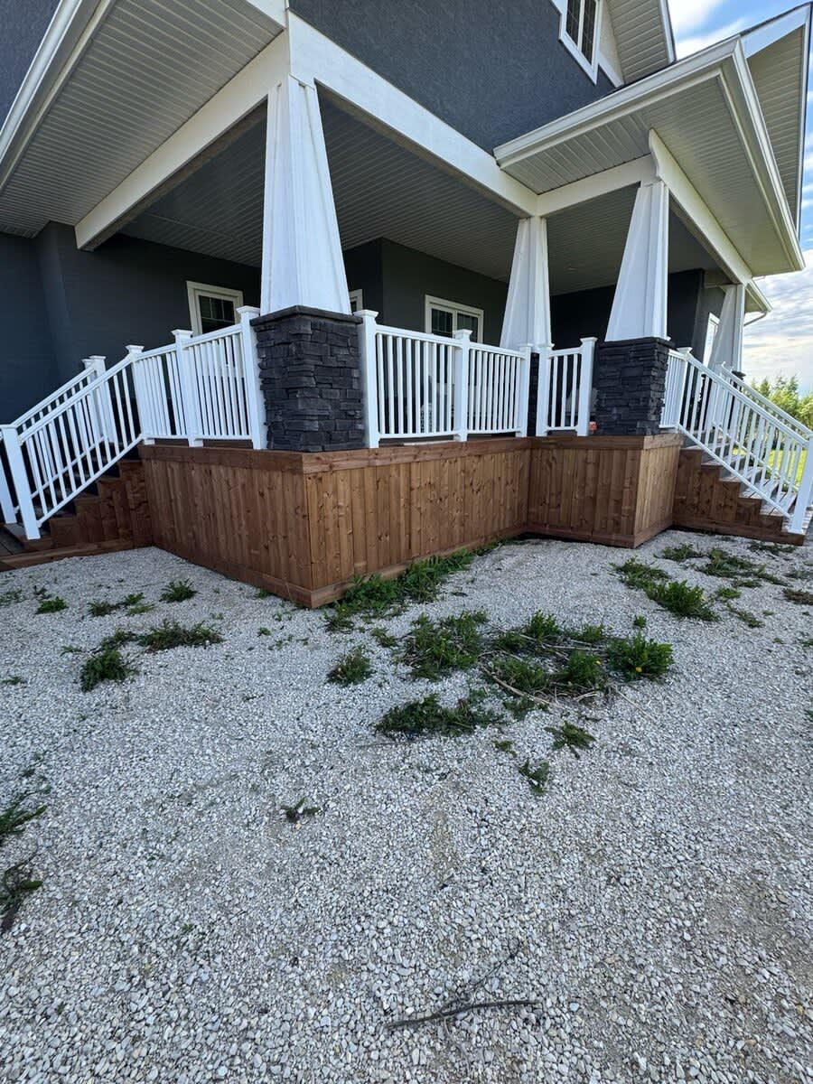 Craftsman porch with white railings