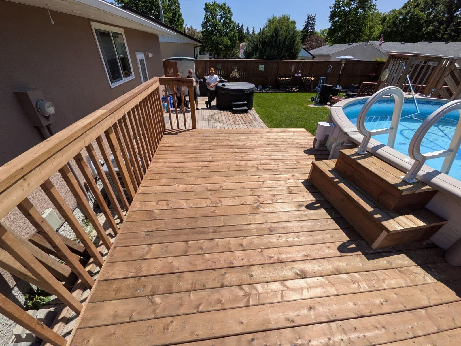 Backyard deck with pool and hot tub