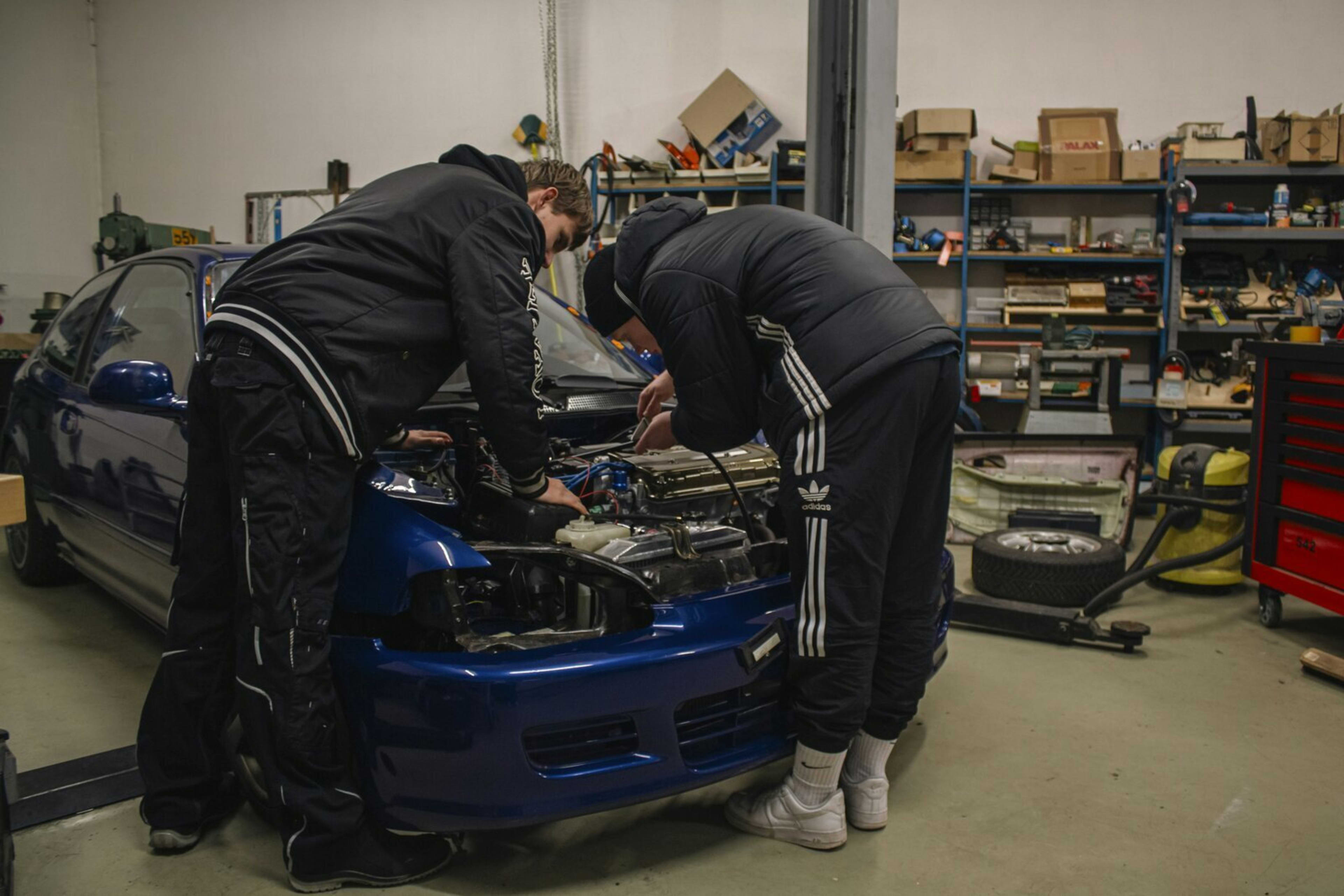 PureGloss Detailing team working on a vehicle