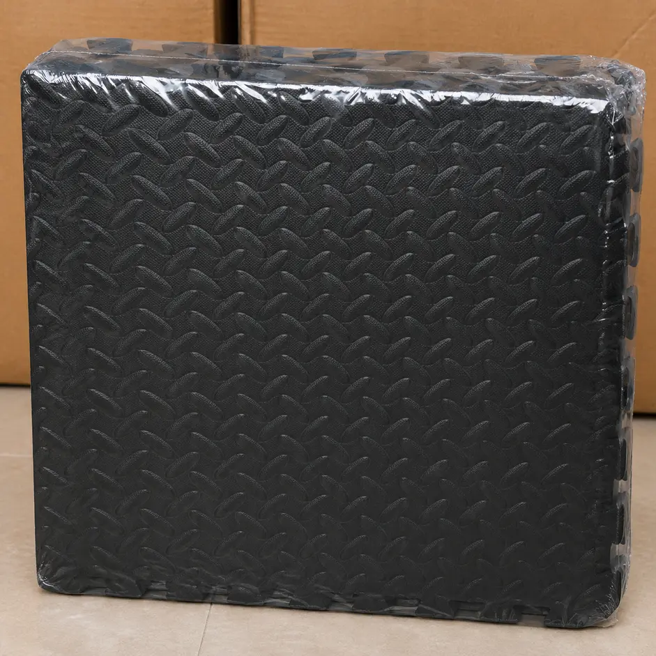 Close-up angled view of interlocking gym floor mat edges showing secure puzzle connection design and thick EVA foam construction.