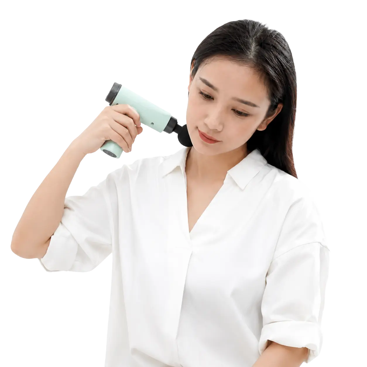 Woman gently using the light-green mini massage gun on her shoulder for muscle recovery