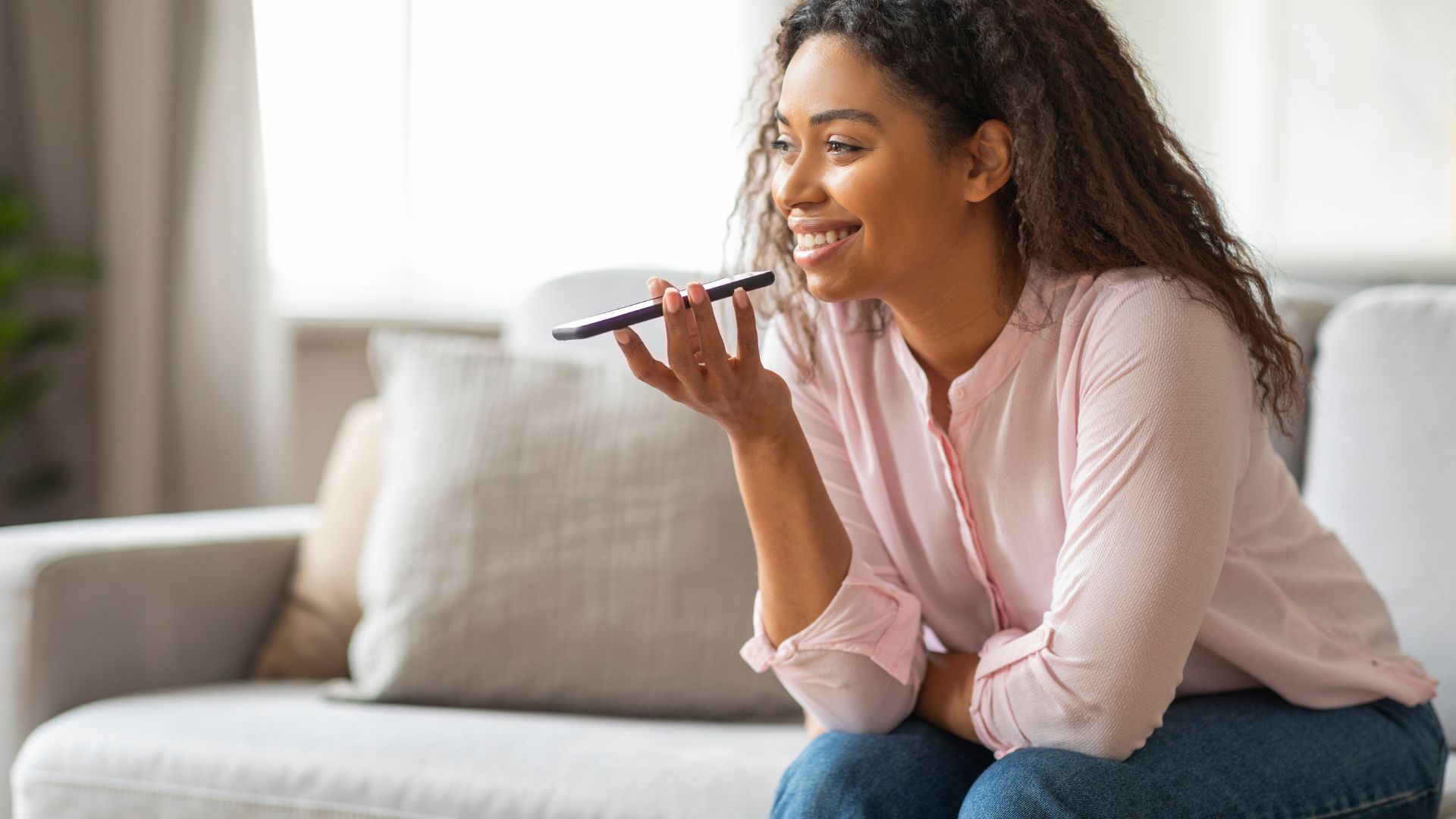 Woman speaking into phone using voice AI